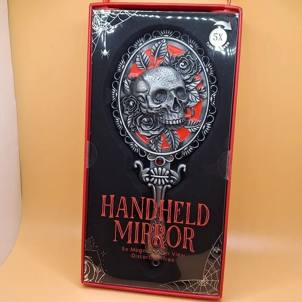 Skull magnifying handheld mirror
